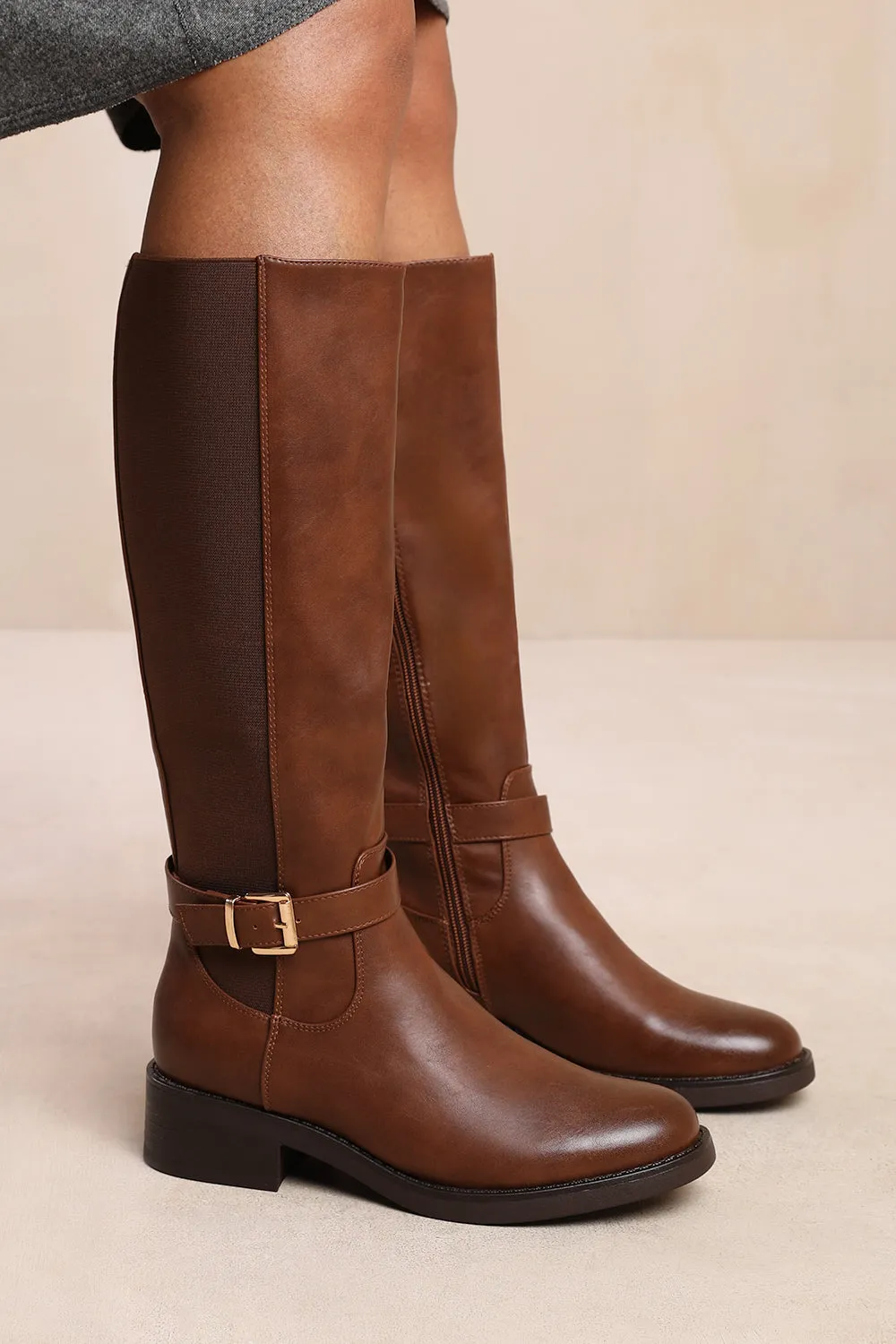 MICAH KNEE HIGH BOOTS WITH BUCKLE DETAIL IN BROWN FAUX LEATHER