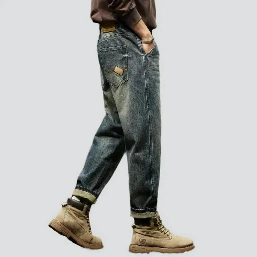 Sanded medium-wash jeans
 for men