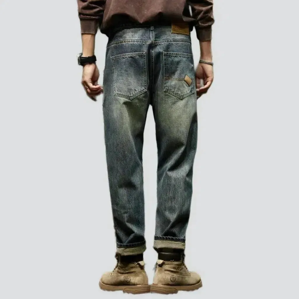 Sanded medium-wash jeans
 for men