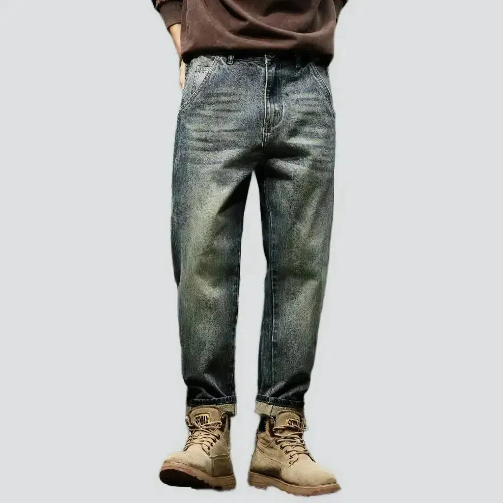 Sanded medium-wash jeans
 for men